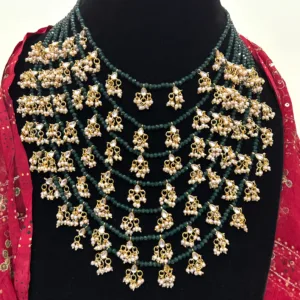 Green Beaded Layered Necklace with Beaded Tassels,displayed on mannequin