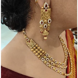 Golden Layered Necklace Set with Maang Tikka-Woman wearing it