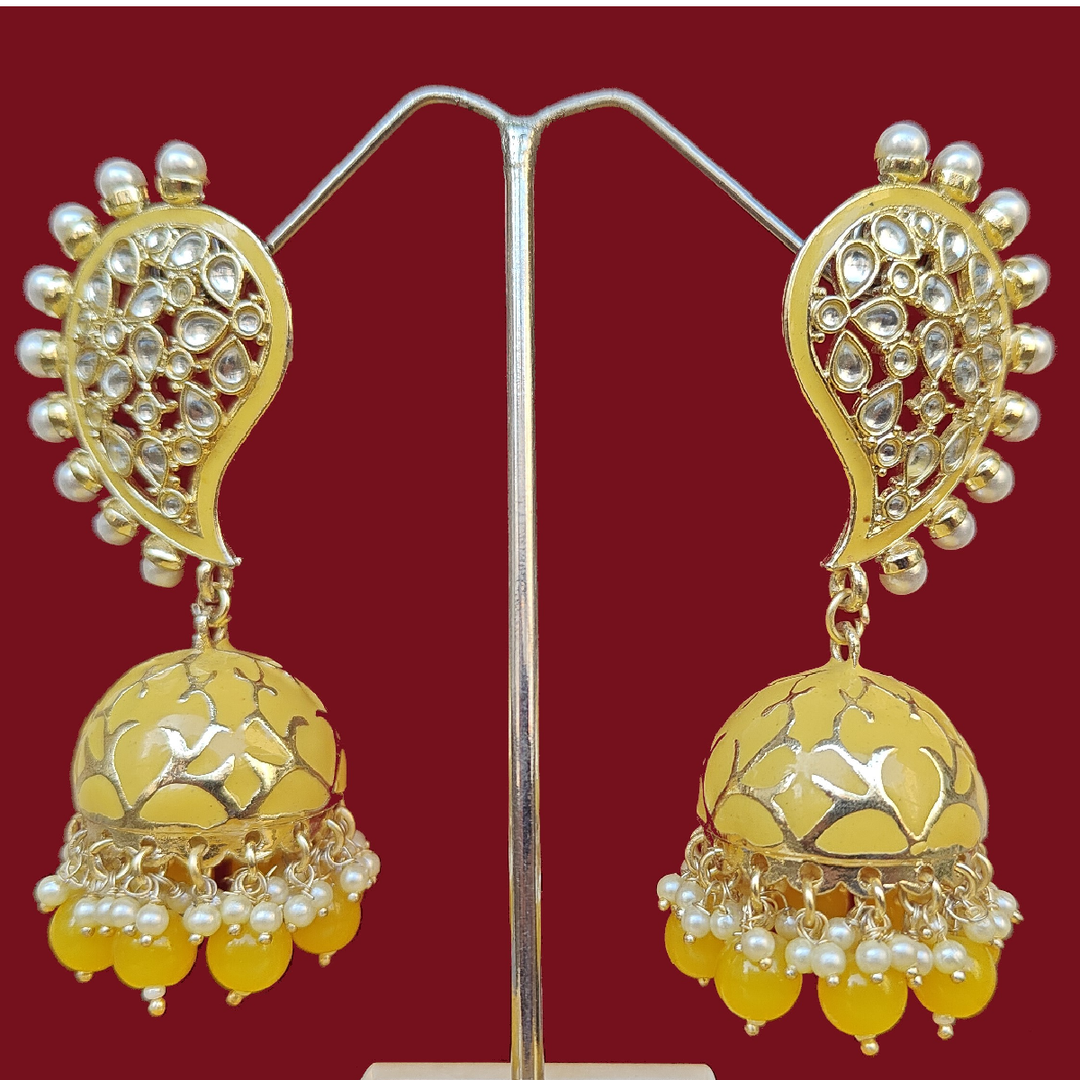 Yellow Earrings Jhumki Style Meenakari displayed on stand