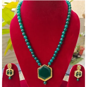 Emerald Green Long Necklace Set-Theva Work displayed on red colour stand