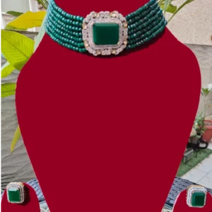 Emerald Green Multistring Choker displayed on a red mannequin
