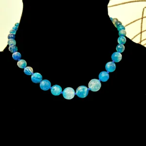 Graduated Blue Beads Collar Necklace displayed on a black colour mannequin