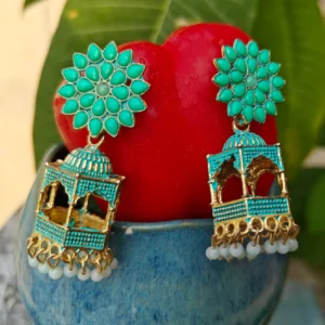 Turquoise Danglers with Green Stud Part - diaplayed in studio environment on a tomato