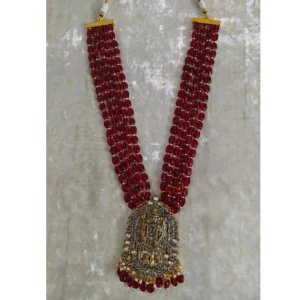 ruby colour multilayer string necklace placed on a cream colour cloth