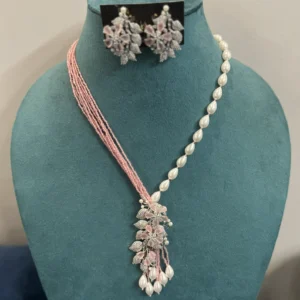 American Diamond Pearl Necklace in Pink displayed on mannequin
