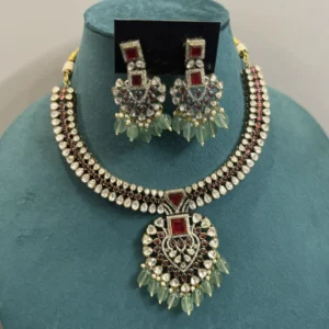 Antique Kundan Choker Set with Ruby and Mint Green Beads displayed on a mannequin