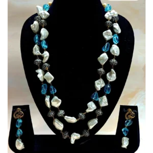 White Baroque Pearl Necklace with Beads in Blue is displayed on a mannequin