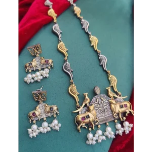 Silver Gold Polish Necklace Set in Dual Tone Cow Motif displayed on a Fabric Cloth